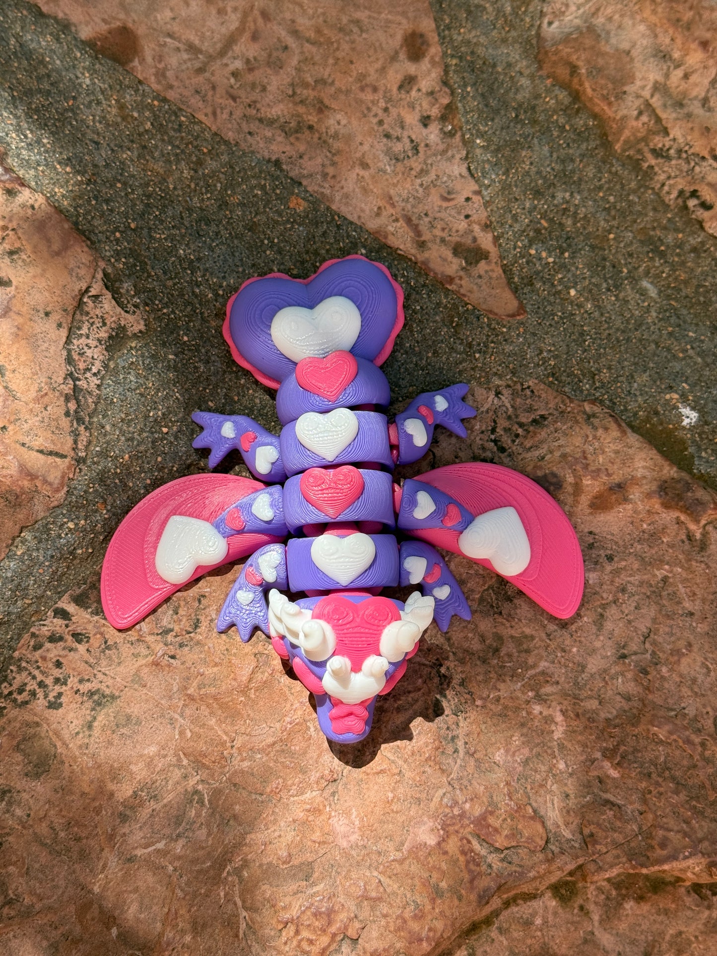 Cute flexi multicolored heart dragon