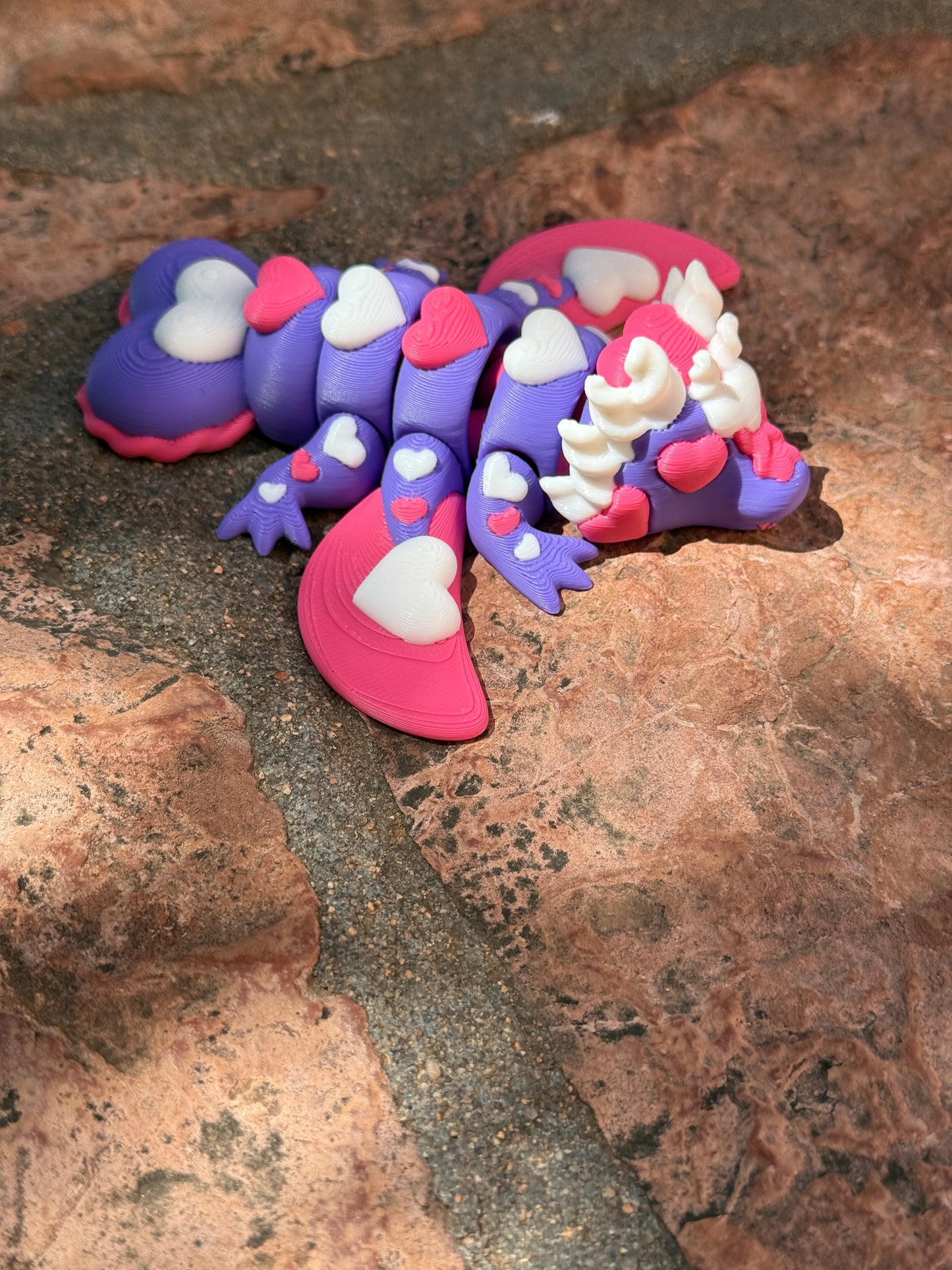 Cute flexi multicolored heart dragon